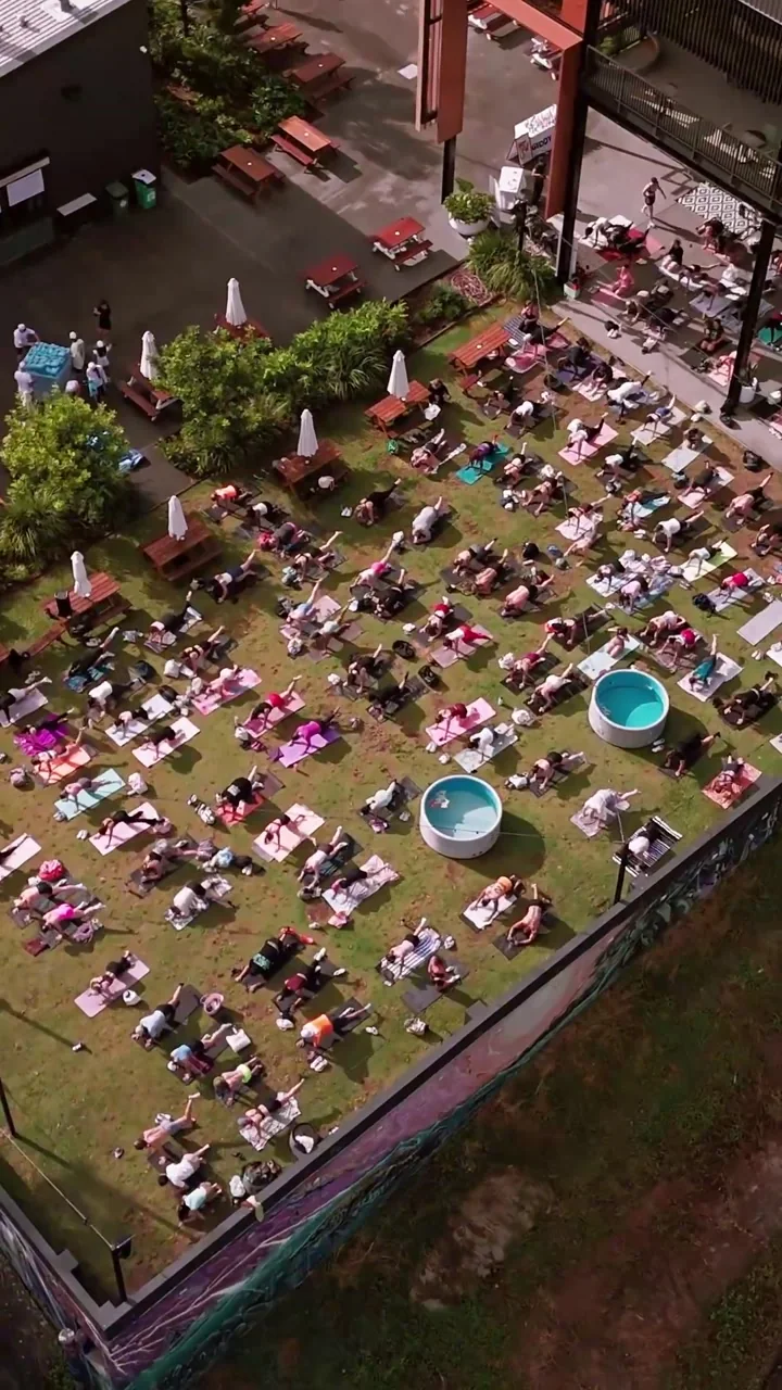 An aerial view of people gathering on the lawn at Hills of Rivermakers.
